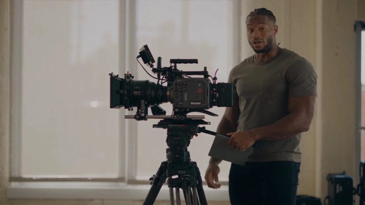 Jaylen beside his cinema camera, preparing a lesson for his followers.